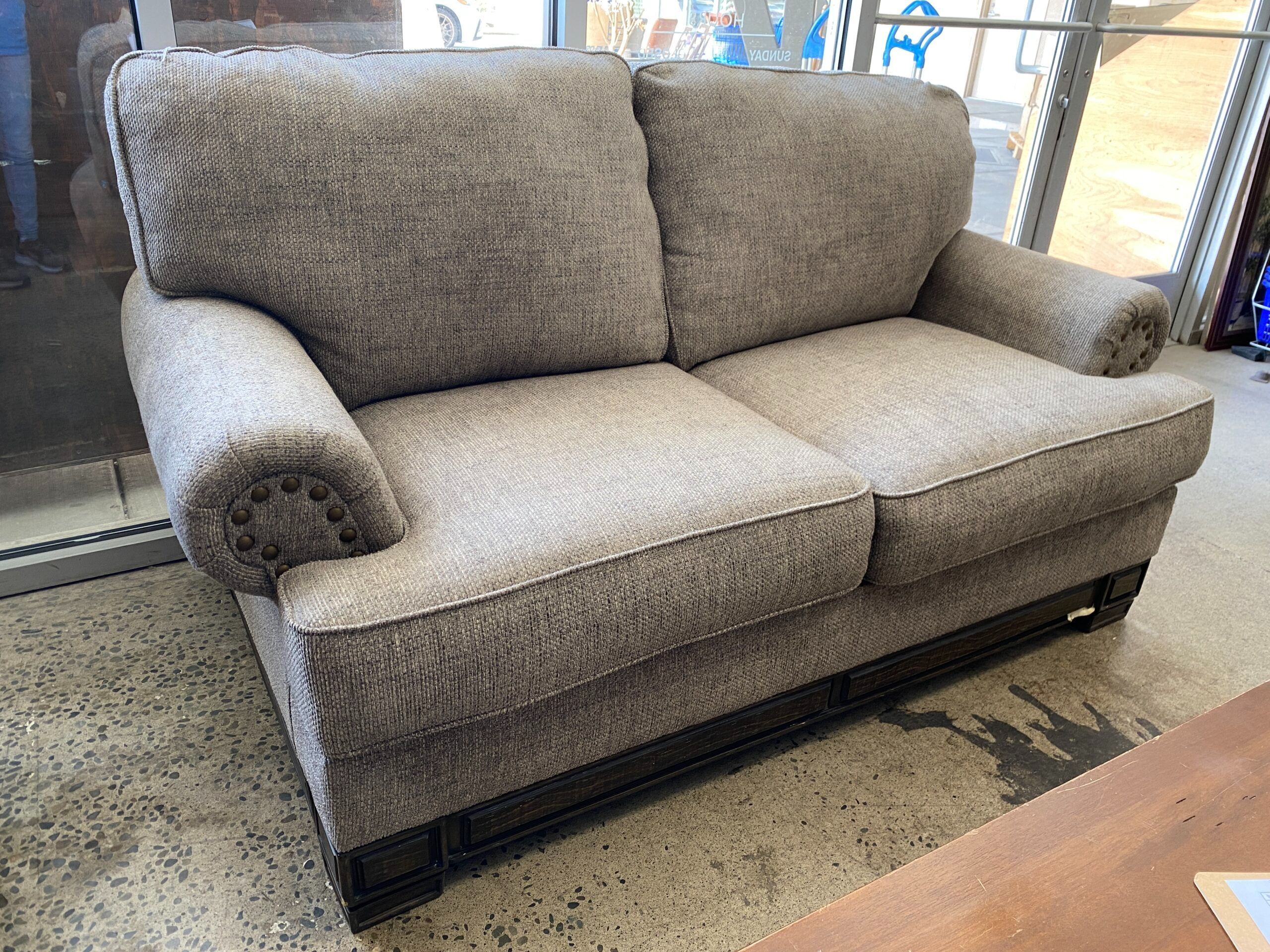 WANEK Grey Fabric Loveseat w/ Large Brass Nailhead Trim