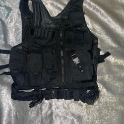 black tactical vest. It is designed for tactical and outdoor use, often seen in activities like airsoft, paintball, hunting, or training.  These vests