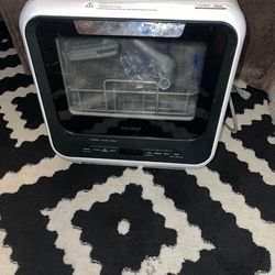 COMFEE countertop portable dishwasher. You can also use it in campers. This compact dishwasher is designed for small spaces like apartments, dorms, or