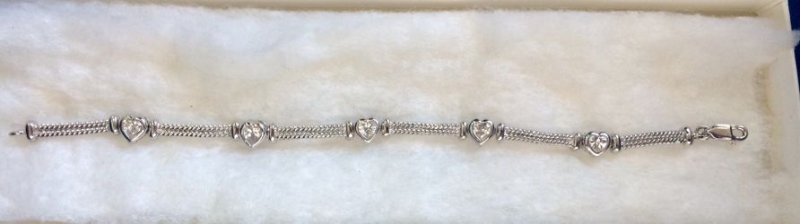 Elegant sterling silver diamond heart bracelet