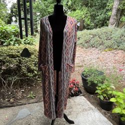 PENDING.  Colorful, light weight, long jacket/cardigan with POCKETS! Size medium.