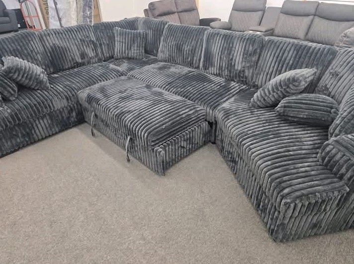 Gray pull out sectional sofa with cuddler corduroyΒ fabric