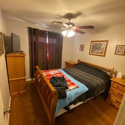 Queen wooden bedroom set comes with bed, mattress,  night stands, dresser and wall photos