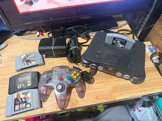Nintendo 64 N64 Console System Bundle W/Atomic Purple Controller & 4 Games Lot!! The product is a Nintendo 64 N64 Console System Bundle, which includ