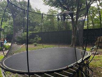Springfree Oval Trampoline (~8 ft x 11 ft) with Basketball Hoop Attachment