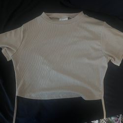 white too off the shoulder and a tan shirt with open back