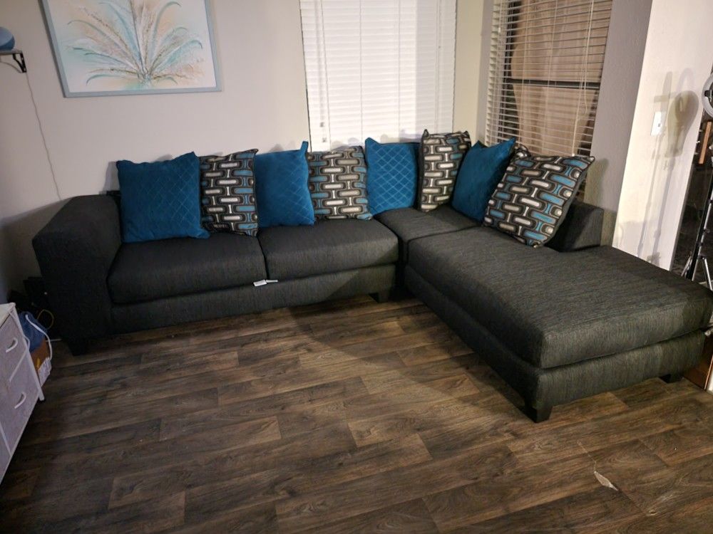 Dark Grey Sectional w/ Blue Accent Pillows