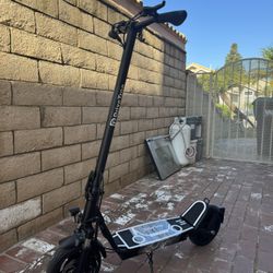 Electric scooter with shock absorber