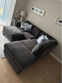 L Shape dark gray sofa with island
