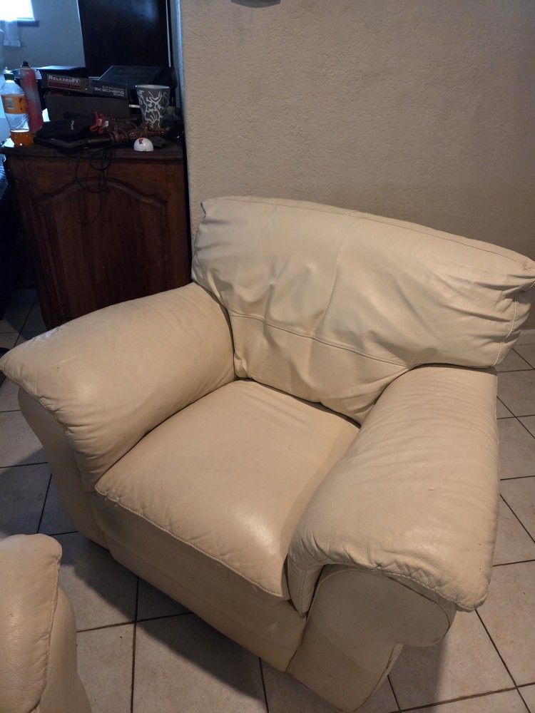 Pair Of Cream Leather Armchairs