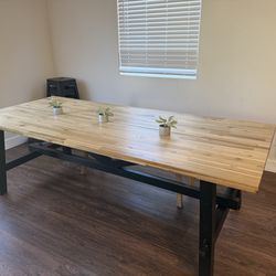 Solid wood IKEA dining table - located in Cadence area