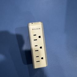 Compact Belkin surge protector with three outlets and two USB ports