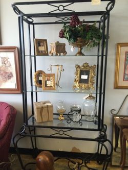 Metal stand with three glass shelves