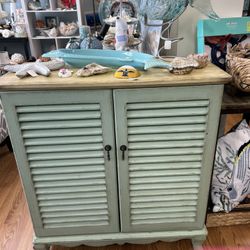 Distressed mint green storage cabinet 34”