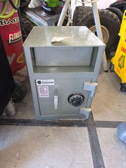 grey Centurion commercial depository safe with a dial lock and front-loading slot.