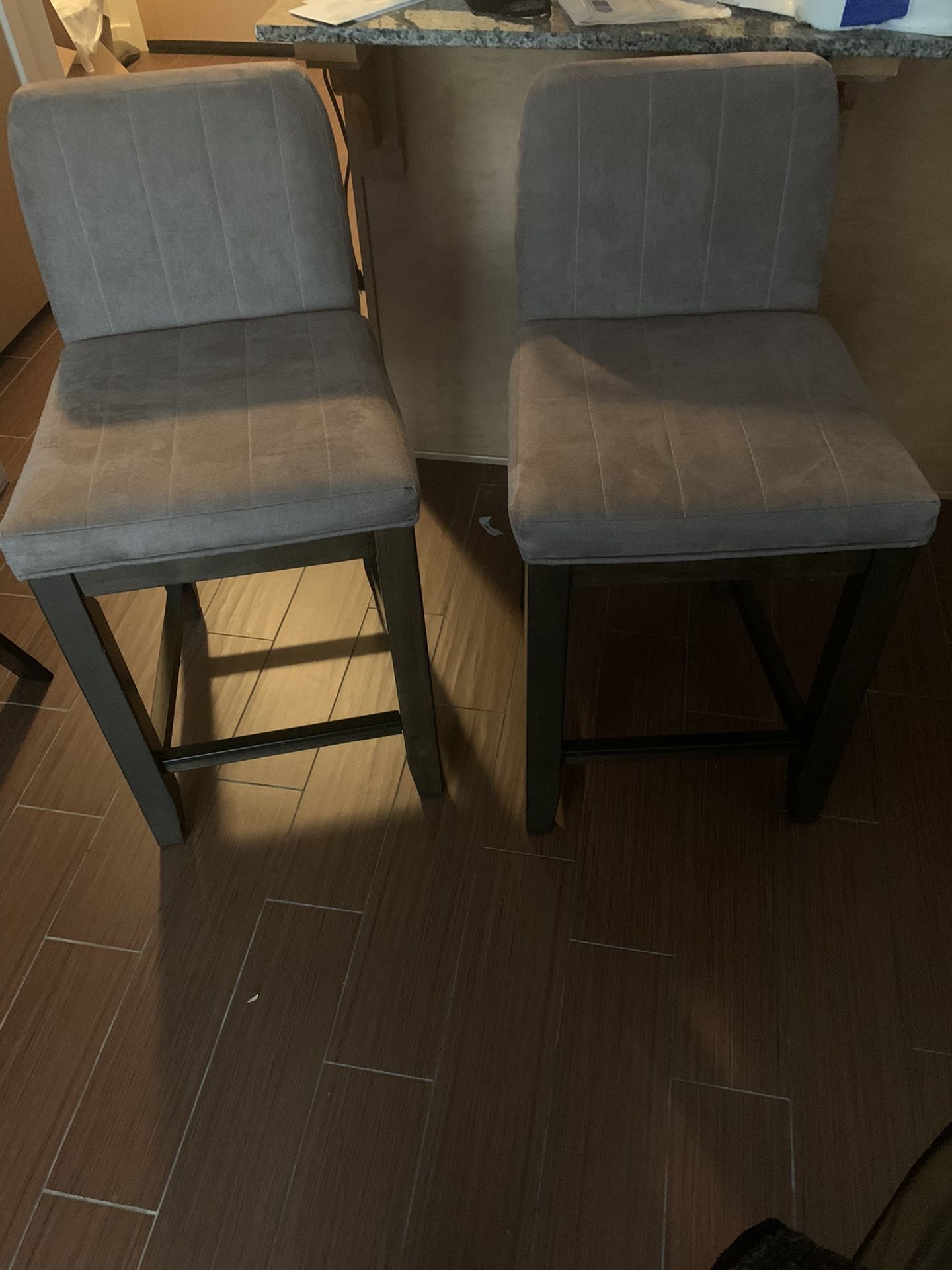 Two high chairs perfect for island counter tops.