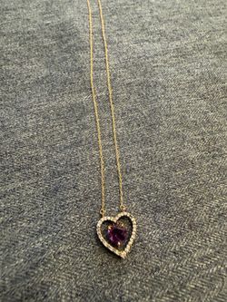 14kt necklace with heart medal and really diamonds