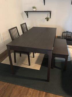 Brand new table and chairs (rug optional)