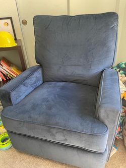 Blue velvet gliding recliner