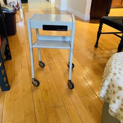 Vintage Antique Great multifunctional serving/side table with slide out drawer. High quality metal. Conveniently mobile on 4 wheels. Table surface: 13