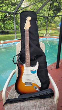 Fender Stratocaster guitar with gig bag