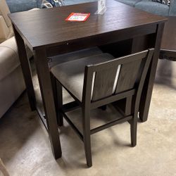 Brand new bar table with two barstools for 399