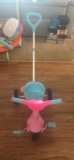 Push and Pedal pink and blue tricycle