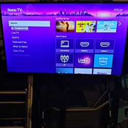4k Roku Tv With Free Roller Tv Cart. Mint Condition 
