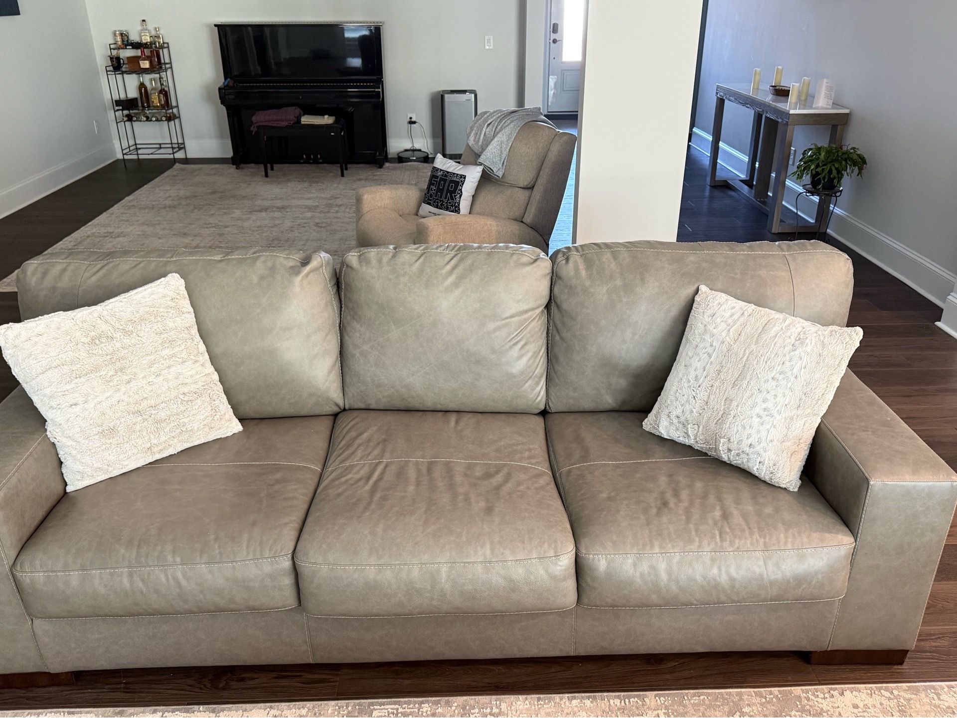 2 Leather couches and matching leather swivel chairs
