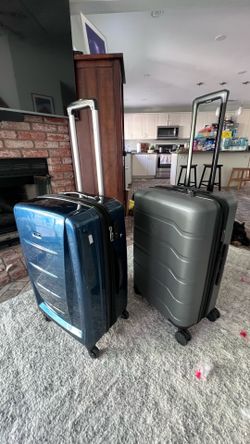 Samsonite blue and open story grey luggage