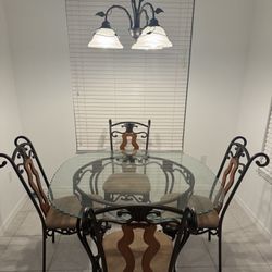 Glass dining table with 4 chairs 