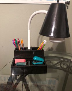 Desk lamp with storage and outlet