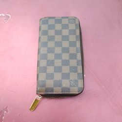 A Louis Vuitton Zip Around  Wallet
