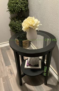 Round black end  table with glass top  $40