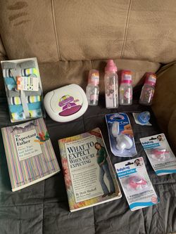 Collection Of Baby Items- New Bottles, Pacifiers, Wash clothes, 2 Books And A Holder For Wipes 