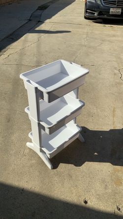 White plastic storage for make up toys etc.