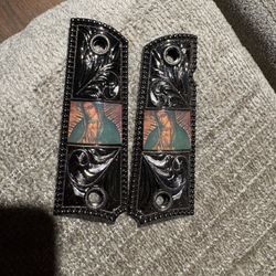 1911 pistol grips featuring a "Virgin Mary Lady of Guadalupe" design. 