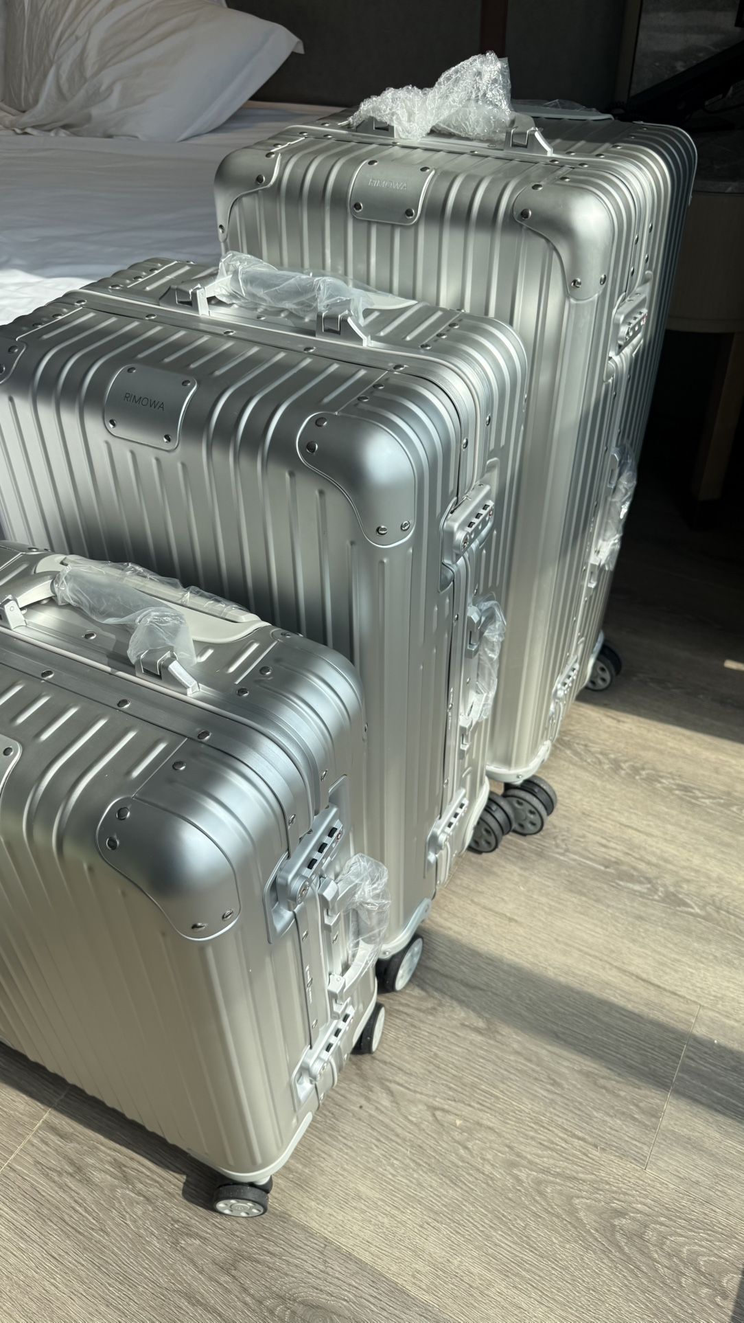 3 Rimowa suitcases