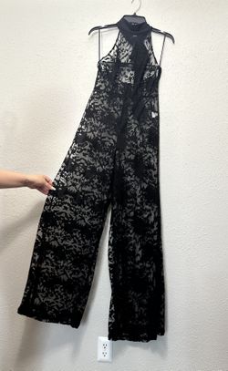 Black Lace Jumpsuit with Floral Pattern and Flowing Fit