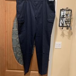 Work pants with an extra pocket on the leg. Color: blue. Size: 46. New. I have 7 of them. Price: $10 all