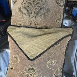 2 Smal Brown Pillows And One Mini Side Pillow