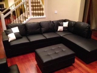 Black Leather Sectional Couch And Storage Ottoman