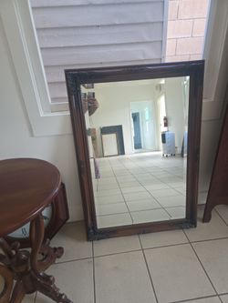 Brown old style mirror