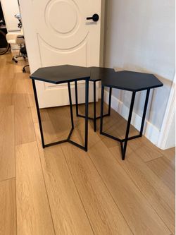 3 piece side tables. Different height - 6 sided. Black wood top metal legs
