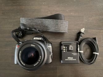 Nikon D3000 DSLR Camera with 18-55mm VR Lens, Battery, Charger & Strap