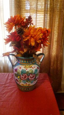 Ceramic flowered vase with autum silk plants
