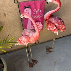 Two Flamingos And A Yard Banner