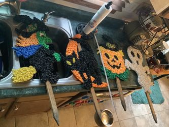 Vintage Haloween set of melted plastic popcorn yard stake figures from the 1970s. Four total Including ghost Jack O lantern witch on broom and black c