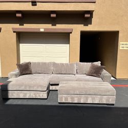 Living Spaces Gray Sectional Sofa + Ottoman – Clean & Spacious 