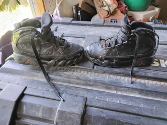 A pair of kids Jordans and a pair of kids converse